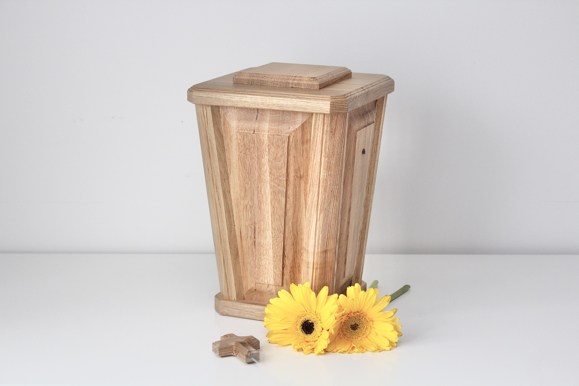 A vase-shaped oak urn