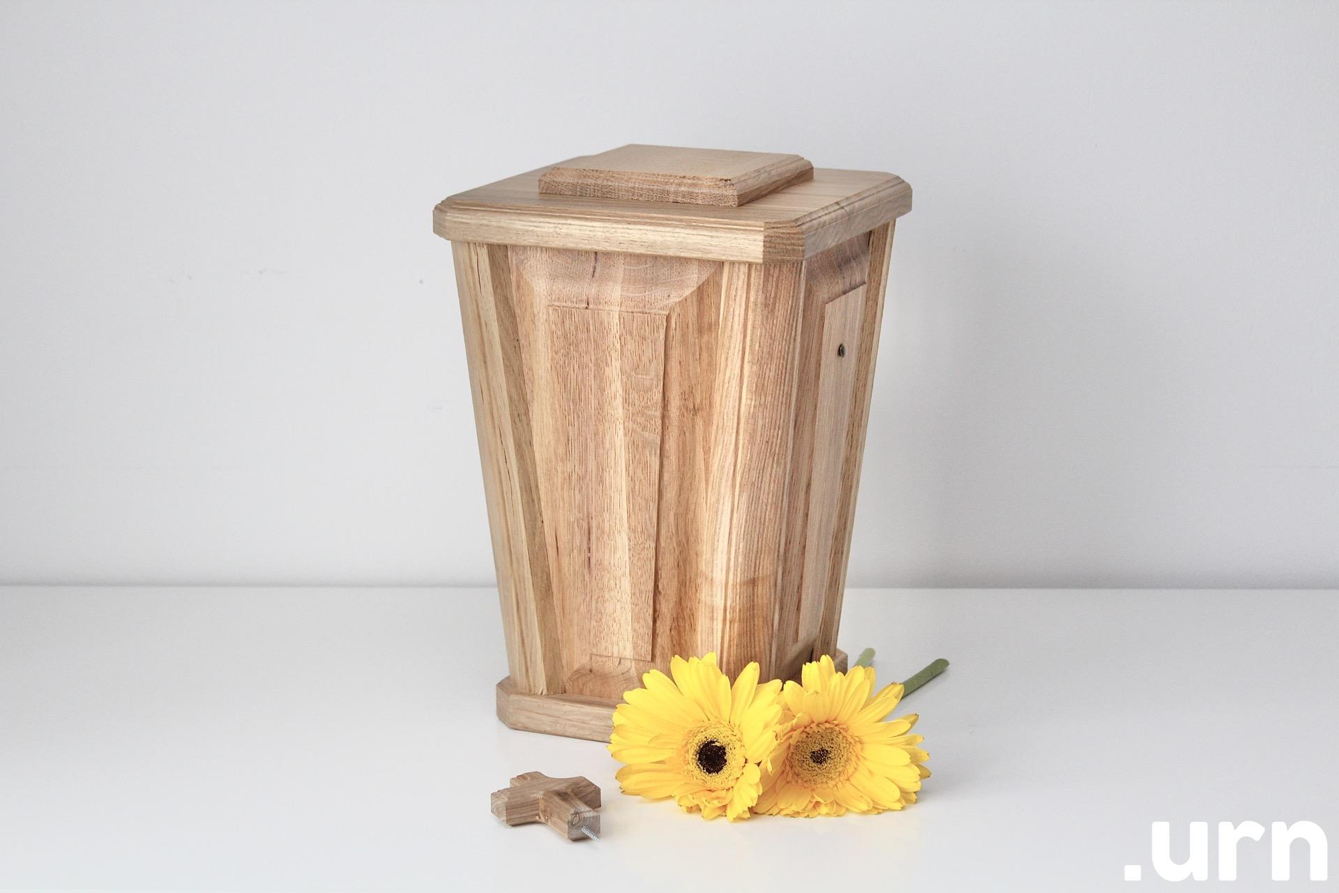 A vase-shaped oak urn