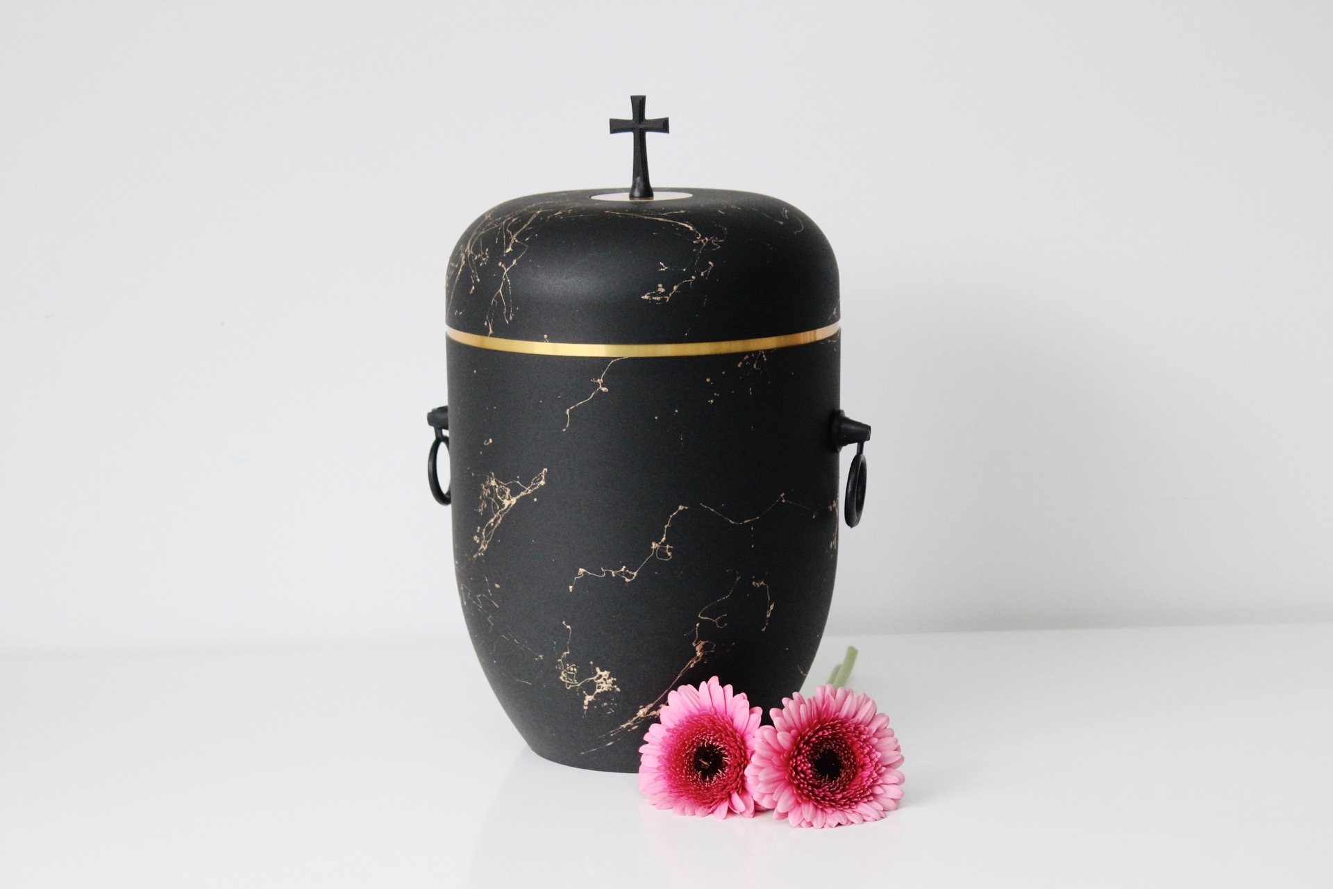 Biodegradable black/gold urn with gold trim